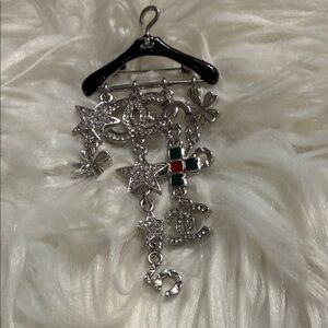 Elegant Silver and Green Brooch with Star and Clover Charms